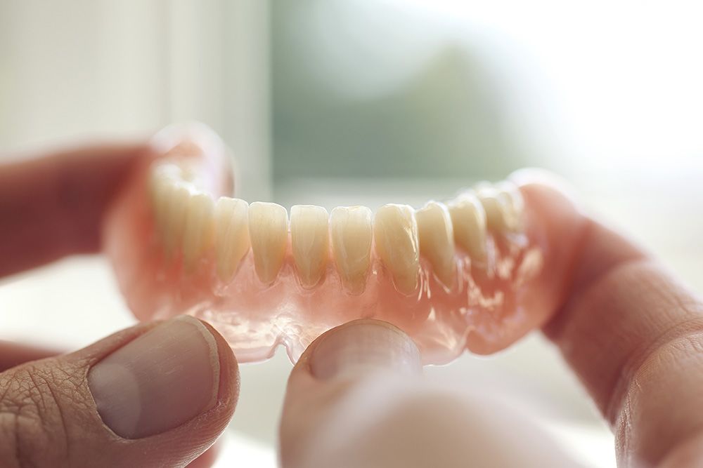 Full-arch lower denture